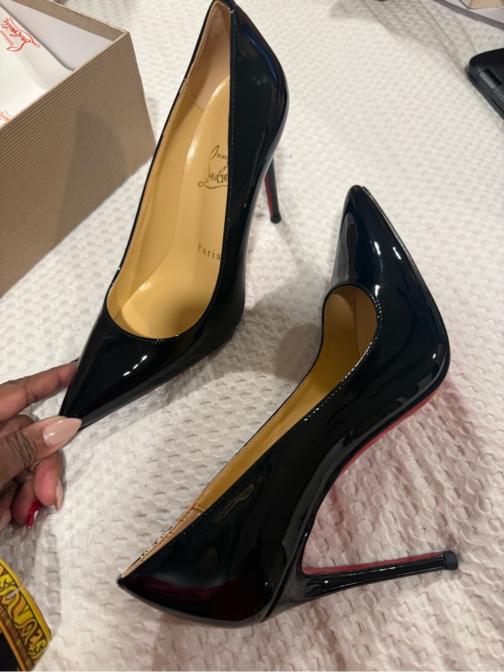 Christian Louboutin Black Patent Pointed Toe Stiletto Pumps with Red Sole.